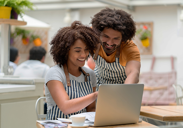 Business owners having a meeting on a laptop